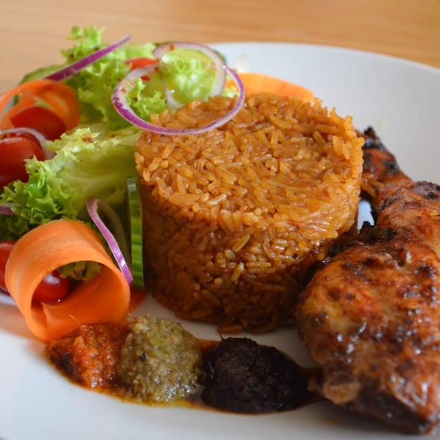 Jollof Rice With 2 Pc Chicken/ Fish.